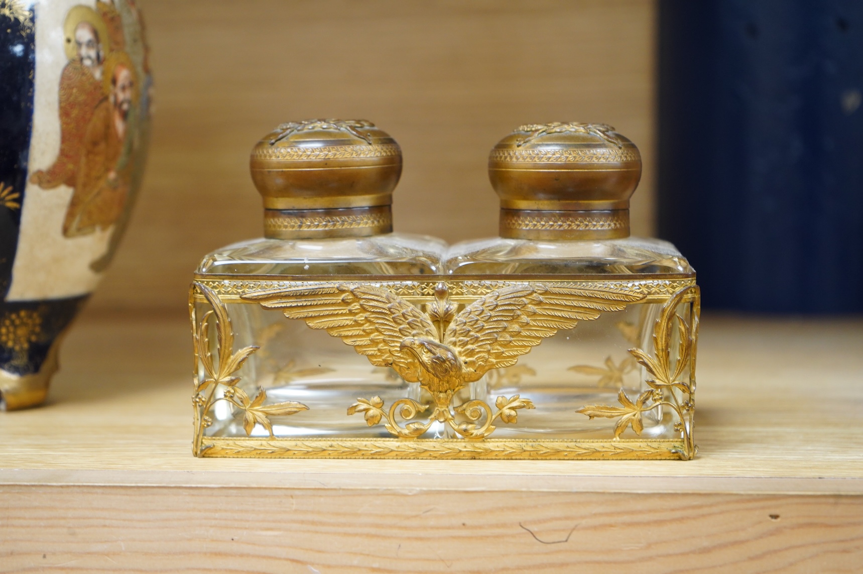 A late 19th/early 20th century French Empire style gilt brass double inkwell, 15cm wide